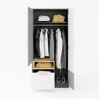 The Pearl Kids Wooden Wardrobe With 2 Doors In Graphite displays folded clothes on top, shirts and jackets on a hanging rod, additional shelves with clothes and shoes below, plus a partially open drawer holding more clothes.