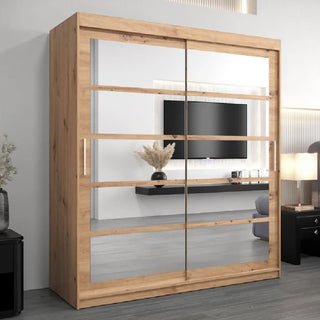 Oak Artisan sliding door wardrobe with mirrored doors reflecting a TV and shelf
