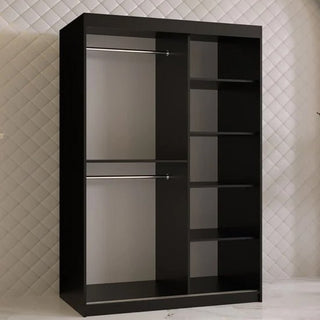 The Rieti II Mirrored Wardrobe in black, featuring two sliding doors, two metal hanging rods on the left, and five shelves on the right, stands against a white quilted wall above a white floor with subtle grey veining.