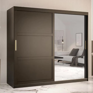 The Rieti II Mirrored Wardrobe with 2 sliding doors in black (200cm) stands against a striped wall in a modern room featuring a marble floor and minimalistic decor, with one door offering a full-length mirror.