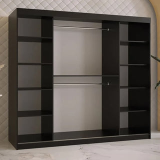 The Rieti II Mirrored Wardrobe, 200cm in black, features two sliding doors, multiple side shelves, and central metal hanging rods. It stands against a quilted beige wall on marble flooring, providing spacious storage with a sleek modern look.