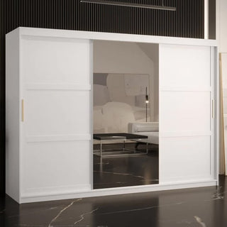 The Rieti II Mirrored Wardrobe with 2 sliding doors in white (250cm) stands against a dark wall, reflecting the room’s modern, minimalist style with its black floor and abstract art.