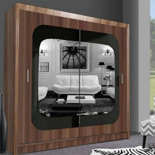 The CHOICEWARDROBE Covina 2 Door Sliding Wardrobe with Central Mirror (150cm, Walnut Finish) features a large mirror reflecting a modern black-and-white living room, making it a stylish and practical bedroom storage solution.
