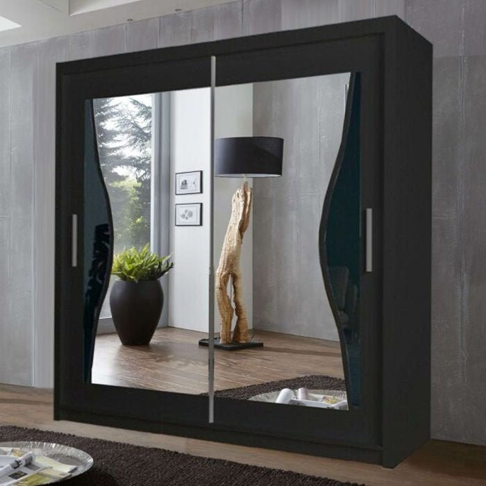 CHOICEWARDROBE Heffner 180cm sliding door wardrobe, black finish, two curved mirrored doors reflecting a floor lamp and plant.