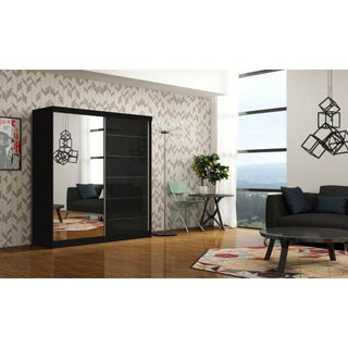 Modern living room with wood flooring, a geometric-patterned rug, black round coffee table, gray couch, green chair with desk, pendant lights, and the INFINITE 2 Door Mirrored Wardrobe Black - 150cm.