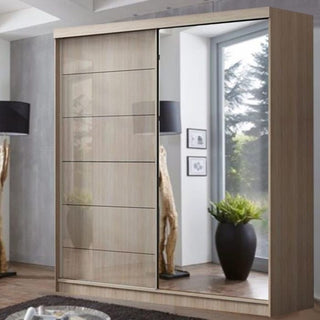 The CHOICEWARDROBE Infinite 2 Door Sliding Mirrored Wardrobe (150cm, Oak Finish) features one wood and one full-length mirror door, providing stylish storage for modern bedrooms with large windows and minimalist décor.