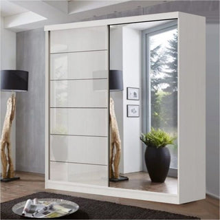 The CHOICEWARDROBE Infinite 2 Door Sliding Mirrored Wardrobe in modern white (150cm wide) features mirrored doors reflecting a large window, plant, and décor in a contemporary, neutral-toned bedroom.