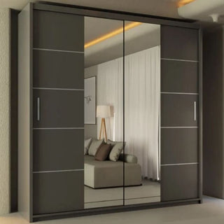 The LISBANE 2 Door Mirrored Wardrobe in grey (150cm) features large sliding doors that reflect a living room with a beige sofa, cushions, floor lamp, curtains, and framed wall art.
