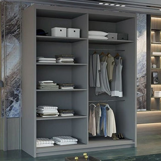 The MERICA 2 Door Mirrored Wardrobe in grey (180cm) features shelves for folded clothes and boxes, plus two hanging rail sections for shirts, dresses, and jackets. This stylish sliding wardrobe stands against a marble-pattern wall.