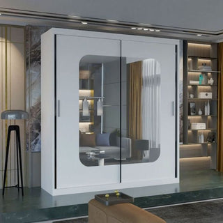 The MERICA 2 Door Mirrored Wardrobe in white (120cm) provides stylish bedroom storage with sleek sliding doors, fitting perfectly in a modern space alongside shelves, décor accents, and a floor lamp.
