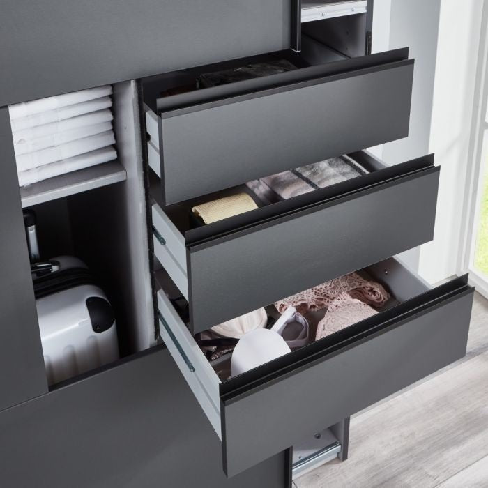 Grey 270cm sliding wardrobe with open drawers showing organised clothes and a white suitcase.