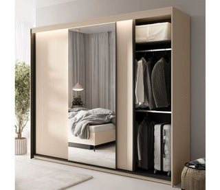 Beige and black 3-door sliding wardrobe with mirrored door and open section showing clothes.