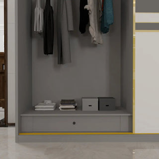 Grey wardrobe interior with hanging clothes, stacked folded garments, and storage boxes.
