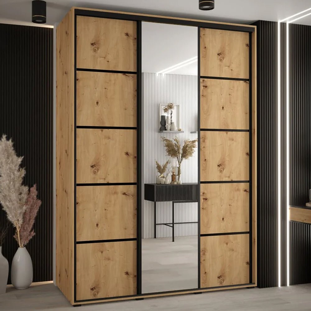 Large wooden wardrobe with artisan oak effect doors, black frame, and three sliding mirrored panels.