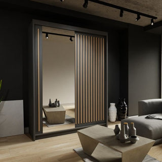 A modern living room with the ZEUS 2 Door Mirrored Black Sliding Wardrobe (150cm), featuring vertical wooden slats and a mirrored door, complemented by contemporary furniture and decorative vases on a wooden floor.
