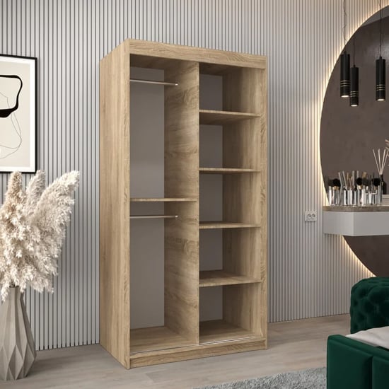 Tavira I 100cm Sonoma Oak sliding mirrored wardrobe interior view with shelves and rails.