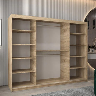 The Tavira I Mirrored Wardrobe with 3 sliding doors, finished in Sonoma Oak and measuring 250cm, features open side shelves and a central section with dual hanging rods, set against a backdrop of modern lighting.
