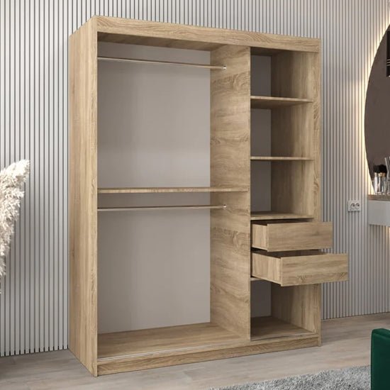 Tavira II Sonoma Oak wardrobe with two sliding doors, one mirrored, showing internal shelves and two drawers.