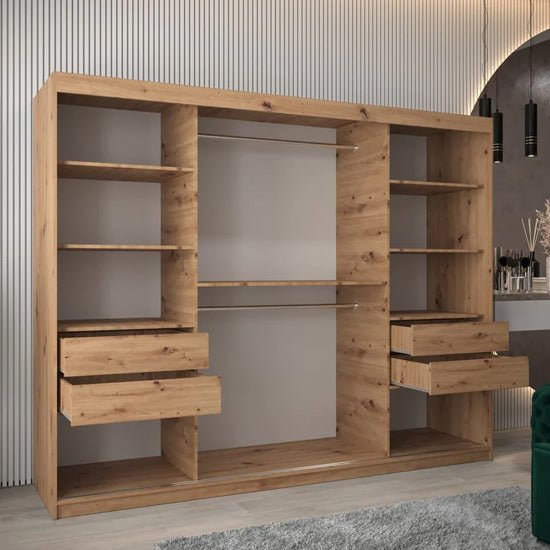 Tavira II 250cm sliding door wardrobe in Artisan Oak with 3 mirrored doors, shelves and visible drawers.