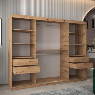 A Tavira Wooden Wardrobe 3 Sliding Doors 250cm in Artisan Oak stands in a modern room with a gray rug, ribbed wall panels, and a glimpse of a mirror and pendant lights on the right.