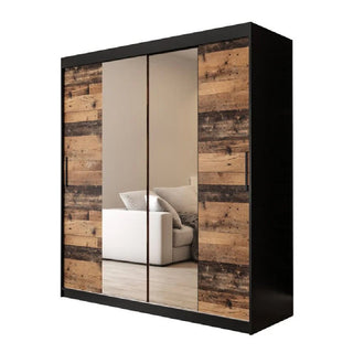 The Topeka 2 Mirrored 180cm Wardrobe features two sliding mirrored doors in dark oak, reflecting a white sofa and adding rustic style to your space.