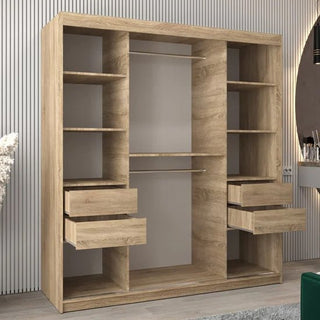 The Vevey I Wooden Wardrobe with 2 sliding doors, 180cm in Sonoma Oak, features shelves on both sides, two central hanging rods, and four partially open drawers, set against a wall with vertical grooves.