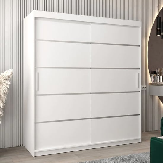 VEVEY I 180cm white sliding door wardrobe against a striped wall.