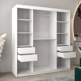 The Vevey I Wooden Wardrobe 2 Sliding Doors 180cm in White features multiple shelves, two hanging rods, and four pull-out drawers—two per side—standing against a wall with vertical lines in a modern room.
