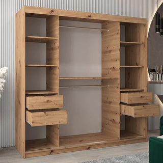 The Vevey I Wooden Wardrobe with 2 sliding doors in artisan oak (200cm) stands against a light-colored wall, featuring open shelves, three open drawers on each side, and two central metal hanging rods.