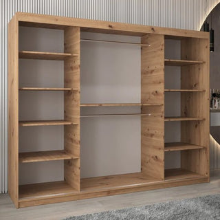 The Vevey I Wooden Wardrobe 3 Sliding Doors 250cm in Artisan Oak features multiple side shelves, two central hanging rods, and a light brown finish, standing on a gray carpeted floor against a modern wall backdrop.