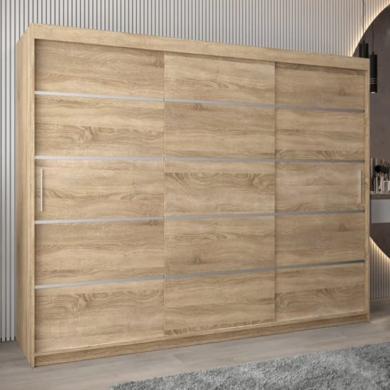 VEVEY I 250cm Sonoma Oak sliding door wardrobe with 3 doors and silver trim detail.