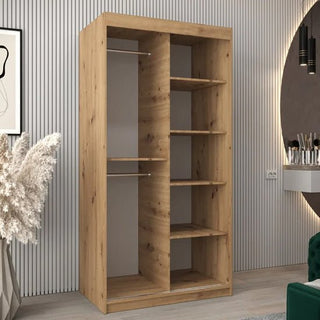 The Vevey II Mirrored Wardrobe with 2 sliding doors in artisan oak features a hanging rod and shelves on one side, multiple vertical shelves on the other, and adds style to any modern room.
