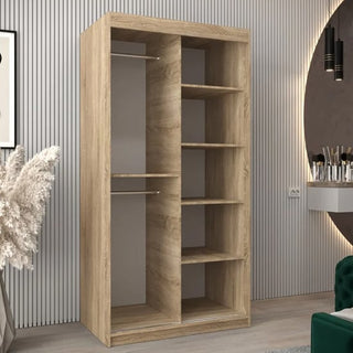 The Vevey II Mirrored Wardrobe with 2 sliding doors in Sonoma Oak features a modern design, offering hanging space and shelves, and stands elegantly against a minimalistic vertically striped wall.