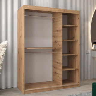 The Vevey II Mirrored Wardrobe with 2 sliding doors in artisan oak (150cm) features two left-side hanging rods and five right-side shelves, shown against a vertically grooved wall in a modern room.