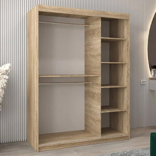 The Vevey II Mirrored Wardrobe with 2 sliding doors in Sonoma Oak (150cm) features a natural wood finish, two left-side hanging rods, and six varied-height open shelves on the right, set against a modern vertical-striped wall.