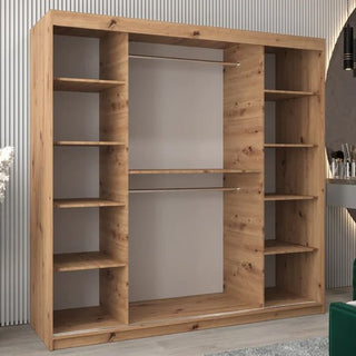 The Vevey II Mirrored Wardrobe 2 Sliding Doors 200cm in Artisan Oak stands against a light, vertically lined wall, featuring a modern look. A gray rug is placed in front of this contemporary wardrobe.