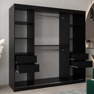 The Vevey II Mirrored Wardrobe with 2 sliding doors (200cm, black) features multiple shelves and drawers on each side and two central hanging rods, standing against a striped wall in a modern room.