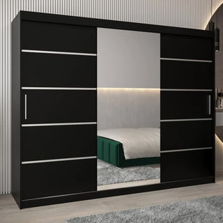 The Vevey II Mirrored Wardrobe 3 Sliding Doors 250cm in Black features horizontal silver handles and a central mirror that reflects bedroom decor, including a bed, wall paneling, and ambient lighting in a modern setting.