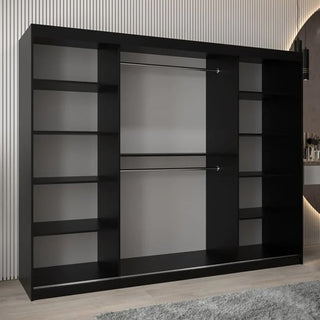 The Vevey II Mirrored Wardrobe, with 3 sliding doors in black (250cm), features multiple side shelves and two central hanging rods. It stands against a vertically lined wall in a modern room.