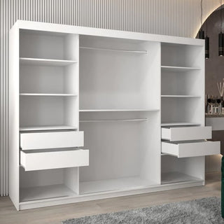 The Vevey II Mirrored Wardrobe with 3 sliding doors (250cm, white) features open shelves, four partially opened drawers, and two hanging rods. It stands empty in a modern room with wood flooring.