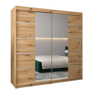 The Vevey III Mirrored Wardrobe 2 Sliding Doors 200cm in Artisan Oak features large mirrored sliding doors, sleek horizontal metal handles, and modern accents, perfect for adding style and function to your bedroom.