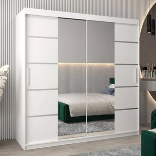 A Vevey III Mirrored Wardrobe 2 Sliding Doors 200cm in White stands in a modern bedroom, its mirrors reflecting a neatly made bed, textured wall, soft lighting, and partially visible vanity with rug.