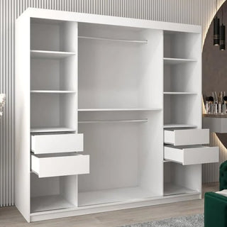 A large Vevey III Mirrored Wardrobe 2 Sliding Doors 200cm in white, featuring open shelves, two hanging rods, and six drawers, stands against a wall with vertical paneling in a modern room.