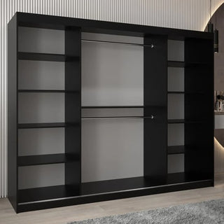 A large Vevey III Mirrored Wardrobe with 3 black sliding doors, multiple side shelves, and two central metal hanging rods stands on a light floor in a modern room.
