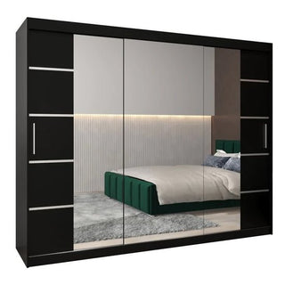The Vevey III Mirrored Wardrobe 3 Sliding Doors 250cm in Black features mirrored doors and adds a modern touch to your bedroom, shown with a green bed, white bedding, cozy rug, and LED-lit vertical wall panels.