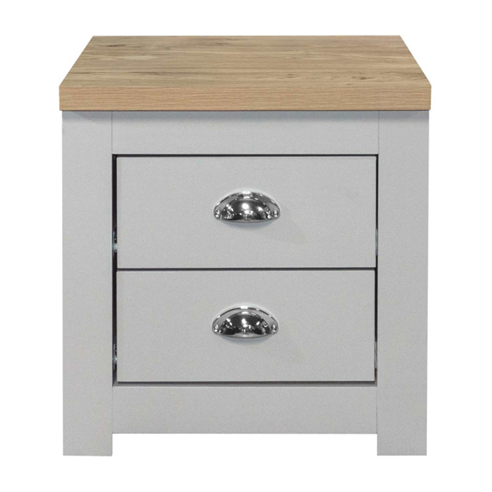 Grey wooden bedside cabinet with oak top and two silver cup handles.