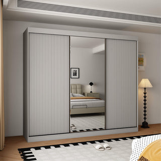 Light grey 3 door sliding wardrobe with fluted outer panels and a central mirror door.