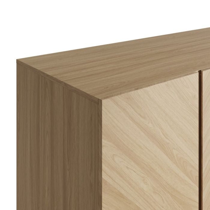 Close-up of a Euro Oak wardrobe with herringbone wood grain detail on doors.