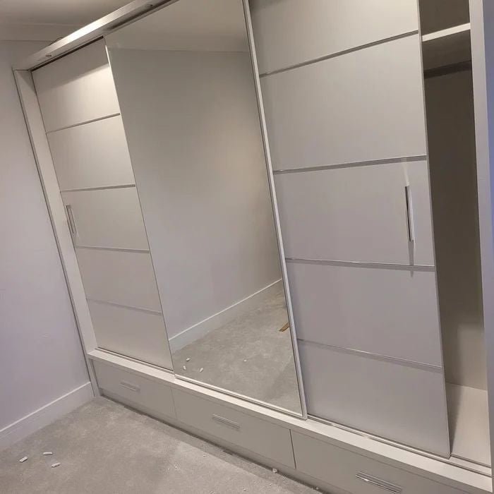White 3-door sliding wardrobe with mirrored panel and bottom drawers