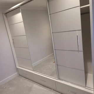 White 3-door sliding wardrobe with mirrored panel and bottom drawers